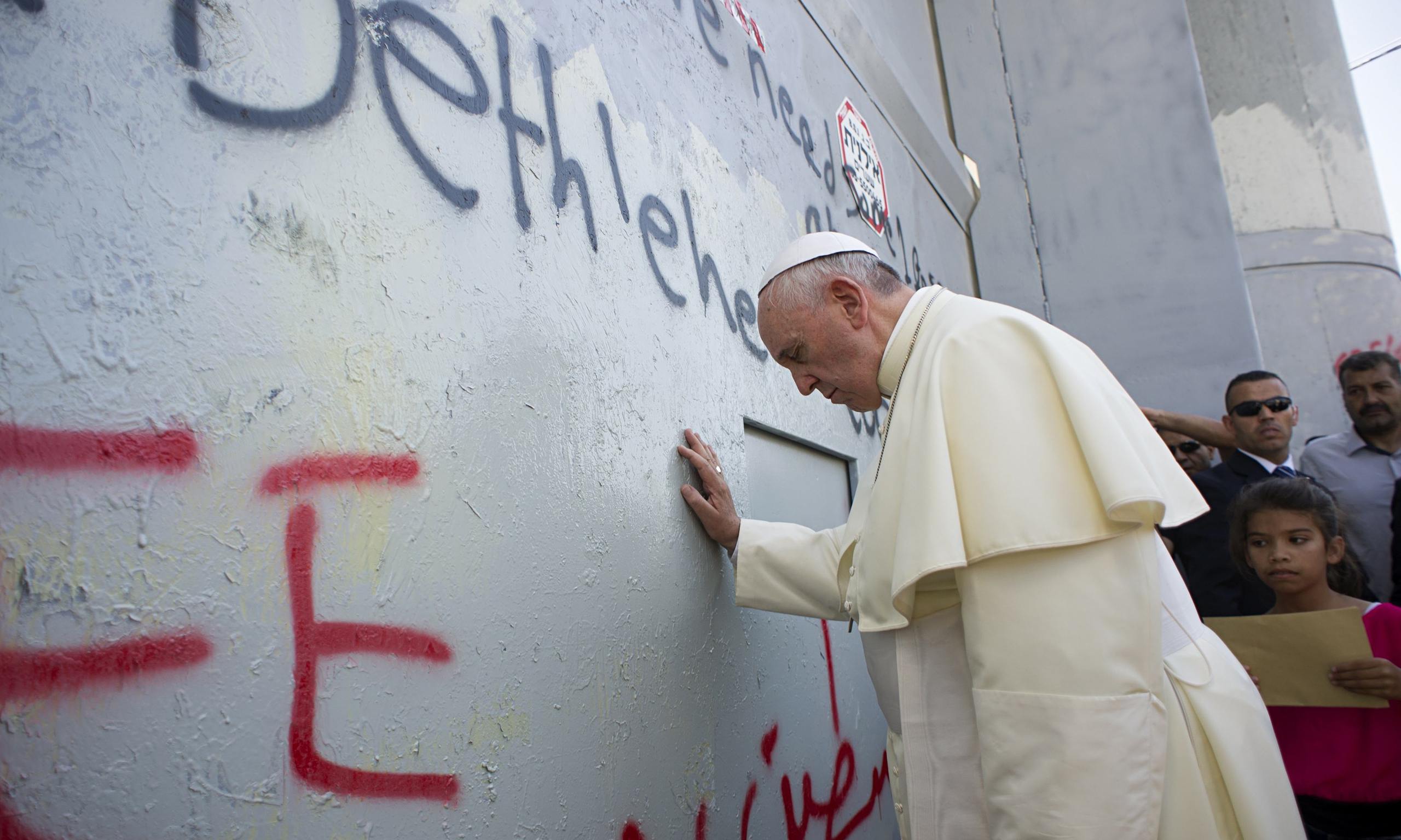 Pope Francis touches wall in Bethlehem